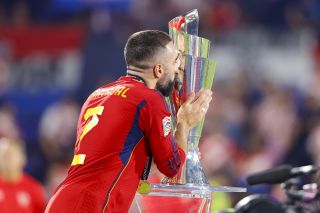 Spain defender Dani Carvajal kisses the UEFA Nations League trophy in 2023.