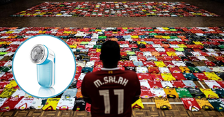 fan of the Liverpool football team stands in-front of the 1278 jerseys displayed side by side on the floor during the Malaysia Book of Records event for the most number jerseys on display of a single team in Kuala Lumpur on April 11, 2018. Malaysia Book of Records announced 1,278 Liverpool jersey from collectors around Malaysia